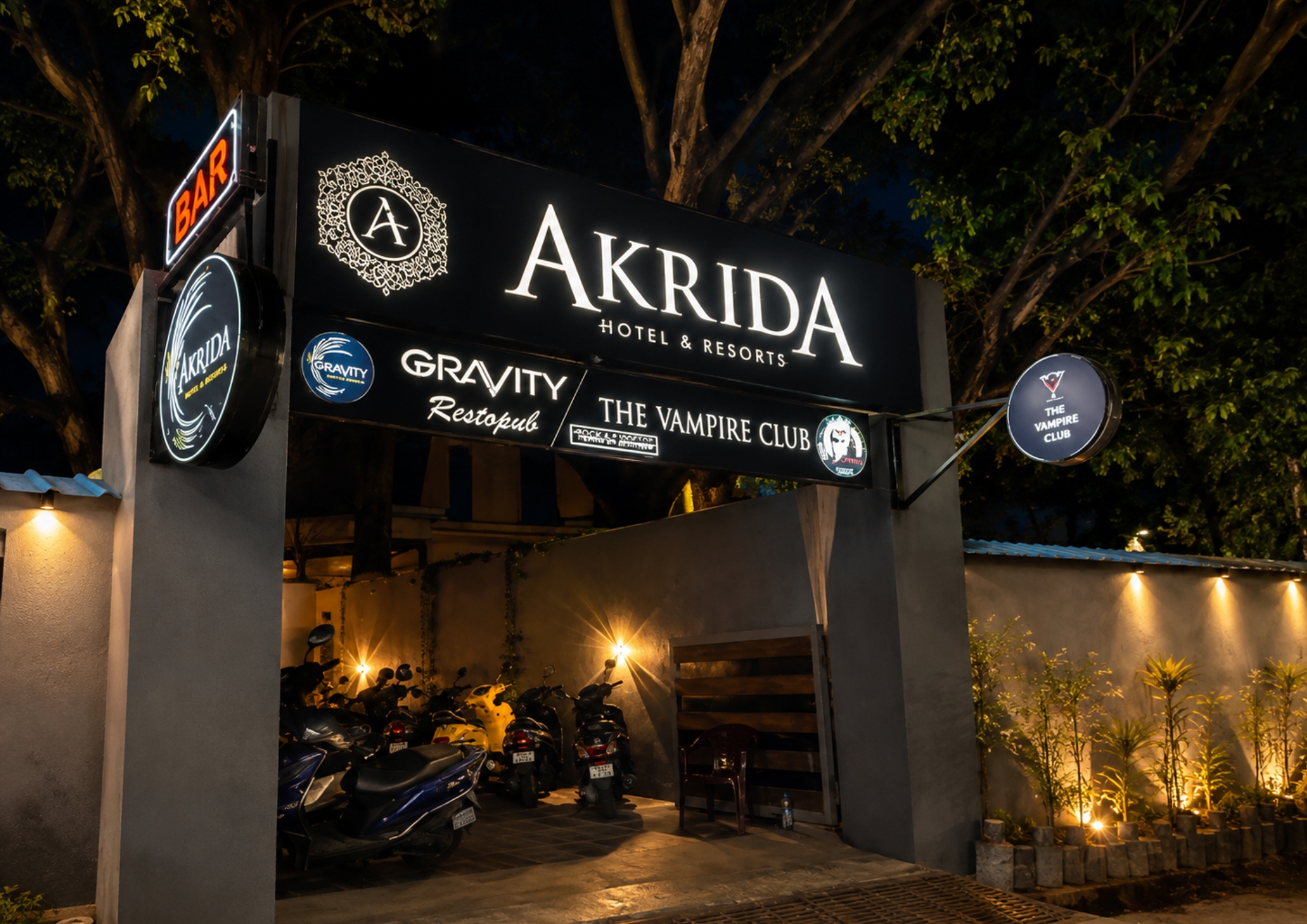 Illuminated Gravity entrance archway at night on Mahatma Gandhi Road, Puducherry